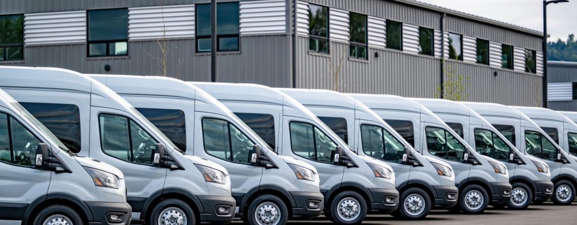 row of commercial vehicle trucks lines up next to each other