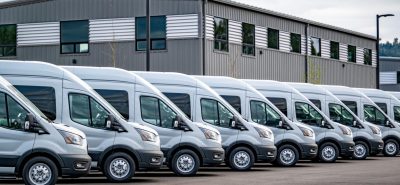 row of commercial vehicle trucks lines up next to each other